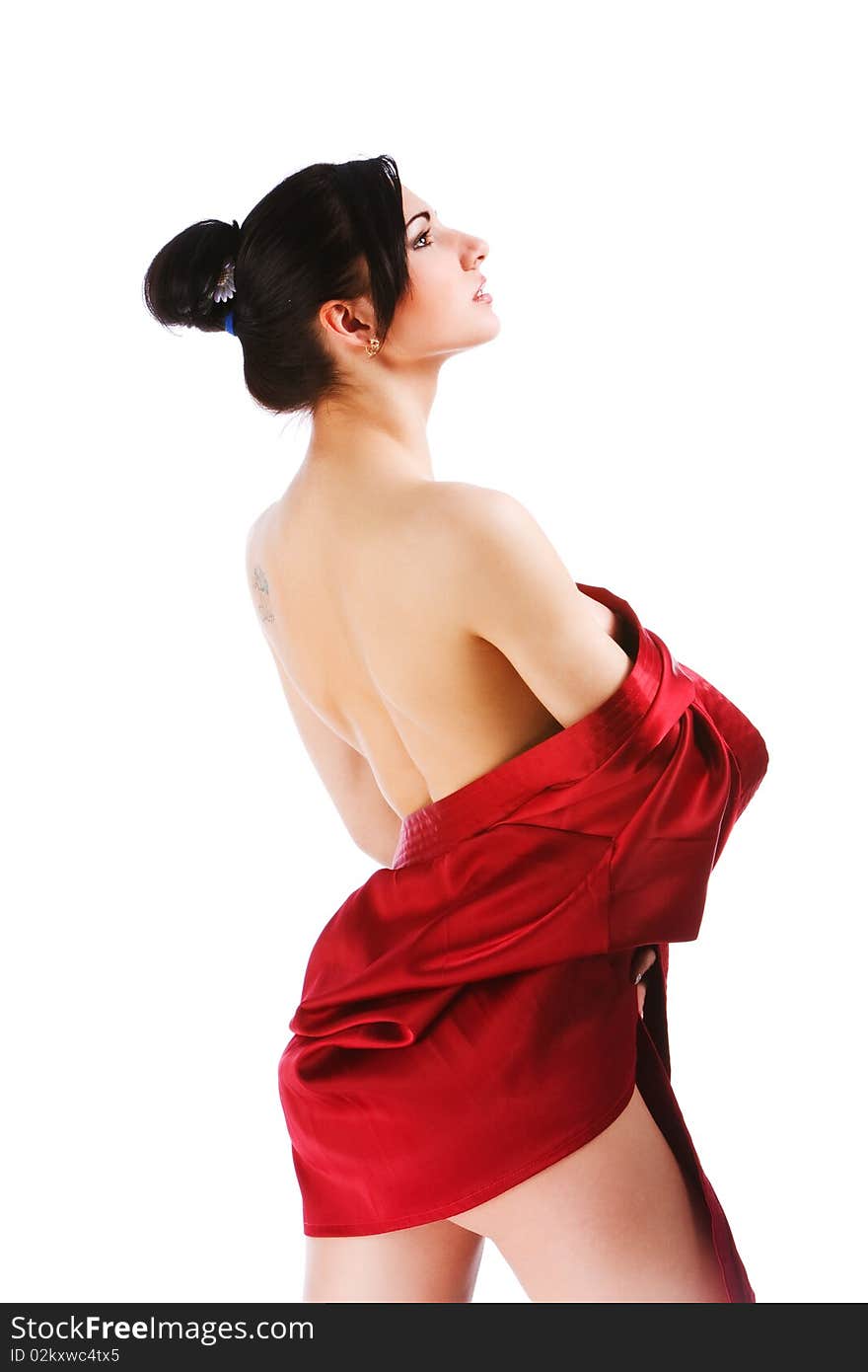 Attractive young naked woman in red gown