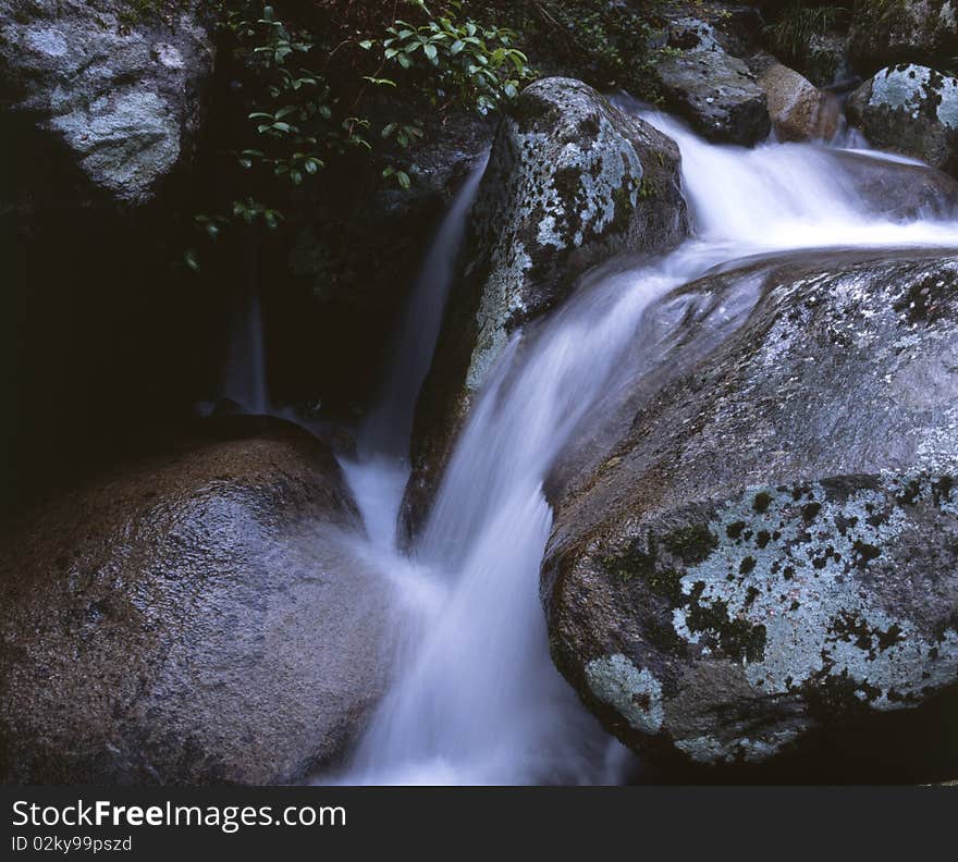 Waterfall in the mountain. Blur and fuzzy.