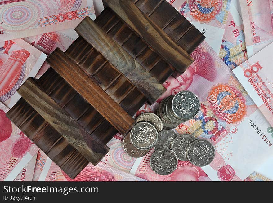 Aged or old wooden box with coin beside, putting on money notes, means money keeping, saving, money protection collection. Aged or old wooden box with coin beside, putting on money notes, means money keeping, saving, money protection collection.