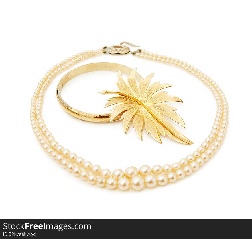 Vintage jewellery - pearls and gold leaf brooch. Isolated on white background. This image is exclusive to Dreamstime. Vintage jewellery - pearls and gold leaf brooch. Isolated on white background. This image is exclusive to Dreamstime.