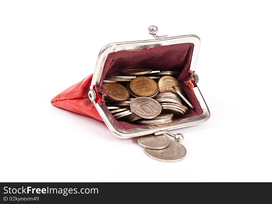 Old red purse against with coins