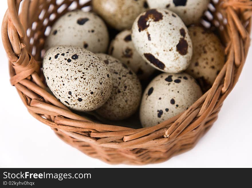 Quail eggs in a basket, top view