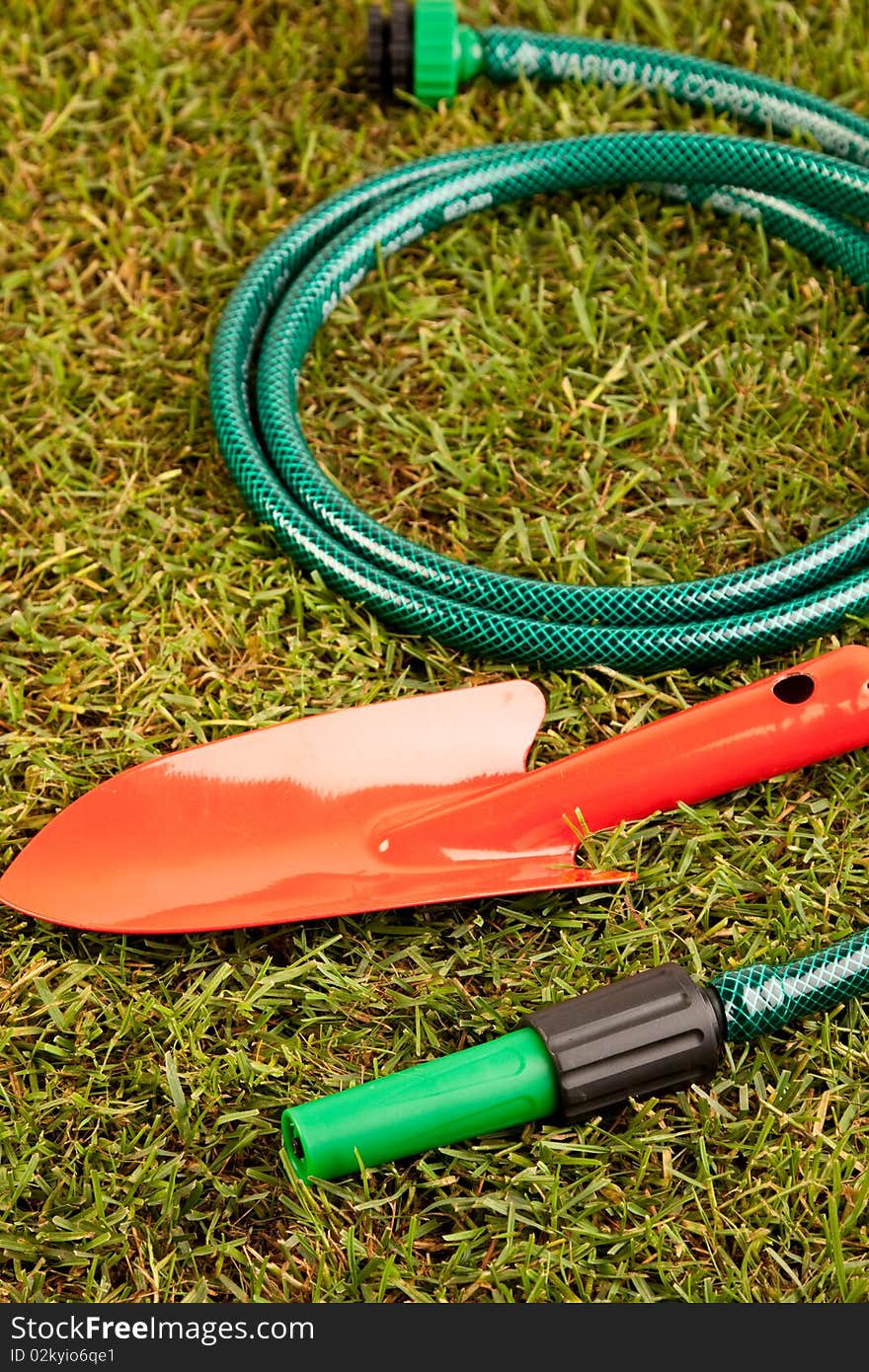 Gardening concept in grass, tools and other equipment