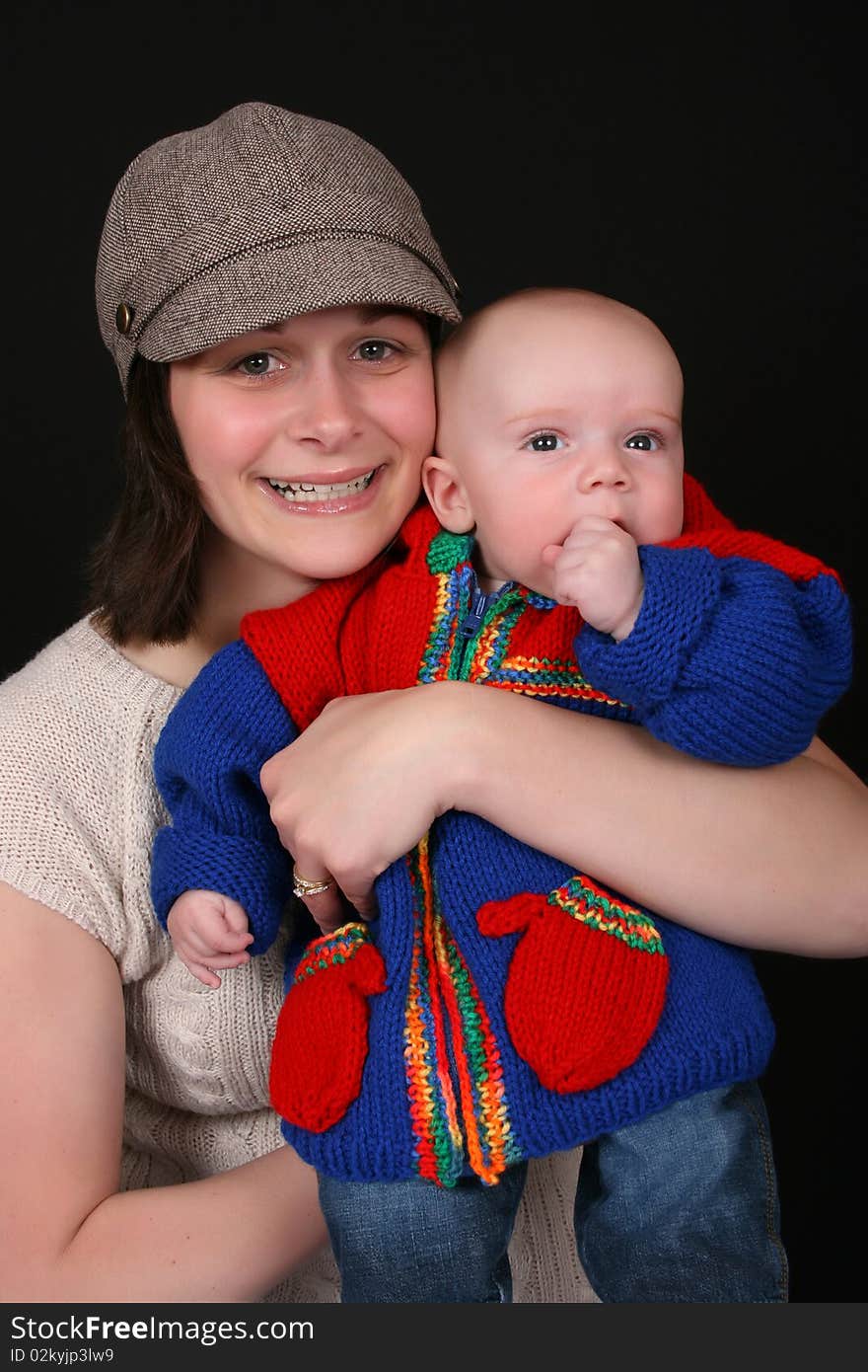 Beautiful mother and baby on a black background