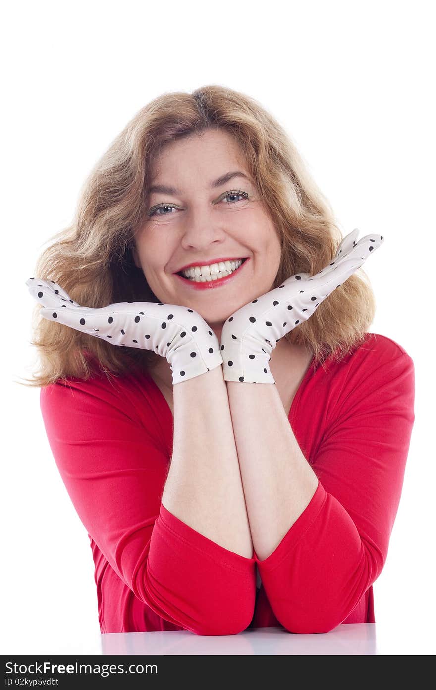 Portrait of a middle-aged woman in red with polka-dot gloves - isolated on white. Portrait of a middle-aged woman in red with polka-dot gloves - isolated on white