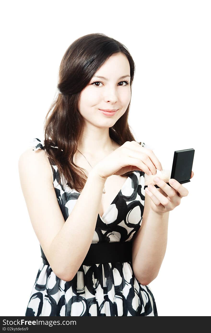 Girl with compact powder and brush isolated on white