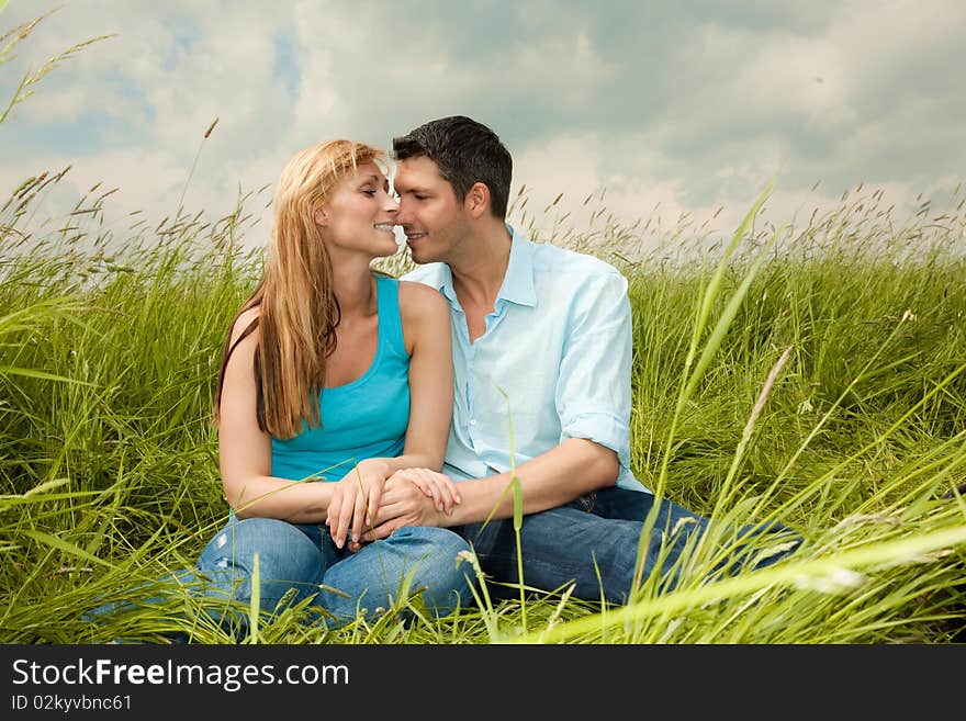 Outdoor couple sitting after bike tour. Outdoor couple sitting after bike tour