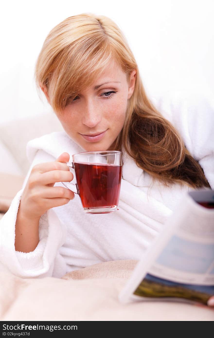 Relaxing female on bed on teatime. Relaxing female on bed on teatime