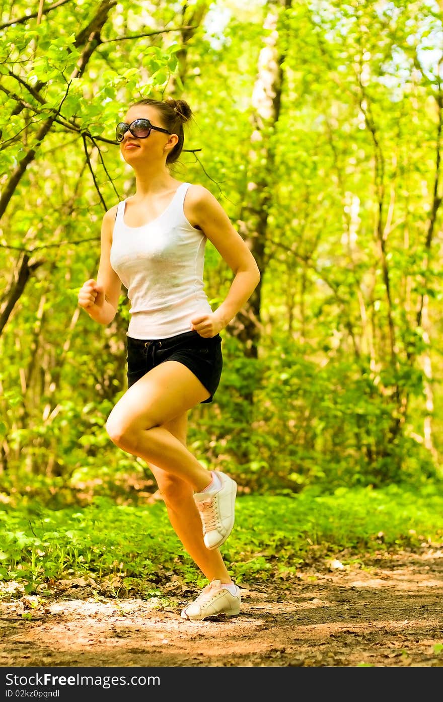 Smiling girl jogging