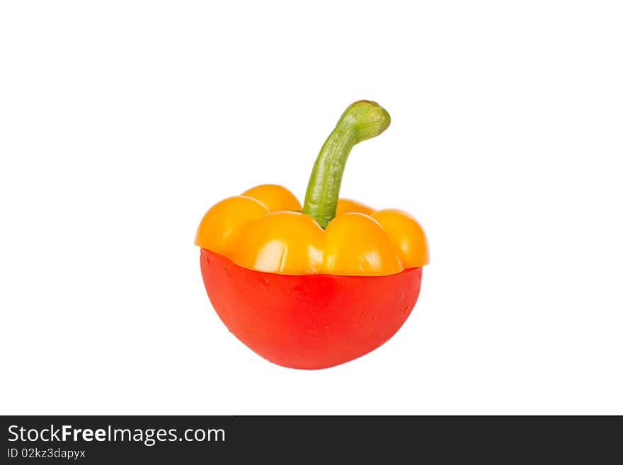 Top of yellow pepper on red tomato. Top of yellow pepper on red tomato