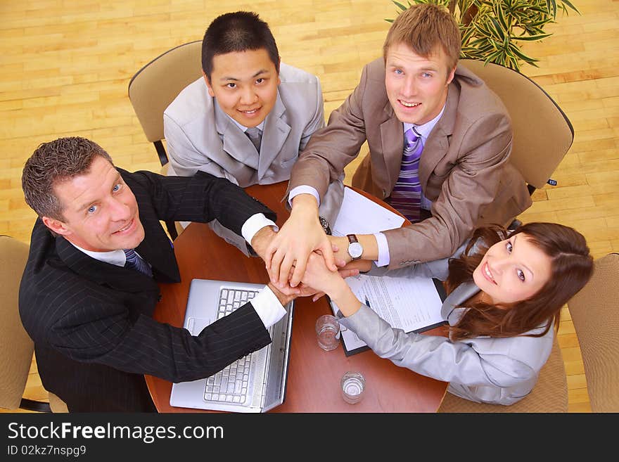 Businessteam and hands on top of each other