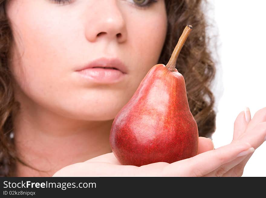 Beauty brunet woman`s fase and pear in hand. Beauty brunet woman`s fase and pear in hand.