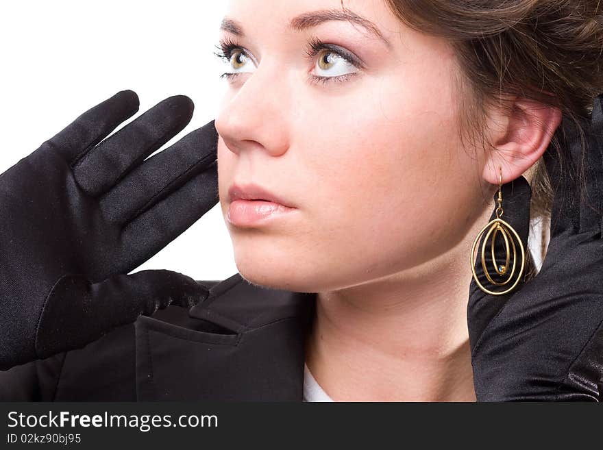 Brunet woman in black gloves. Make-up, hairstyle. Isolated.