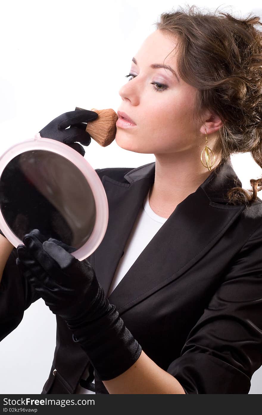 Brunet woman in black gloves. Make-up, hairstyle. Isolated.