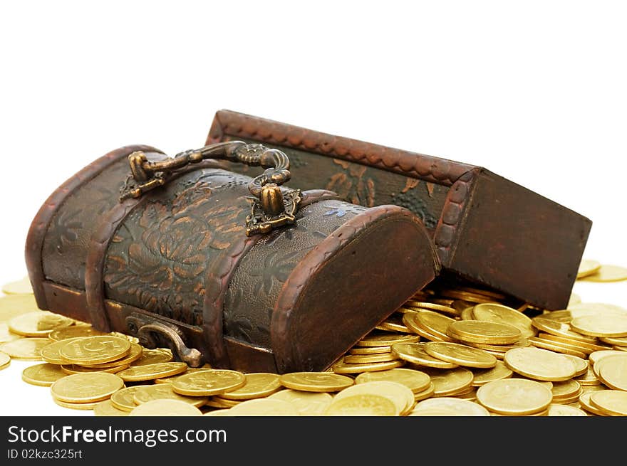 Wooden casket full of coins isolated on white