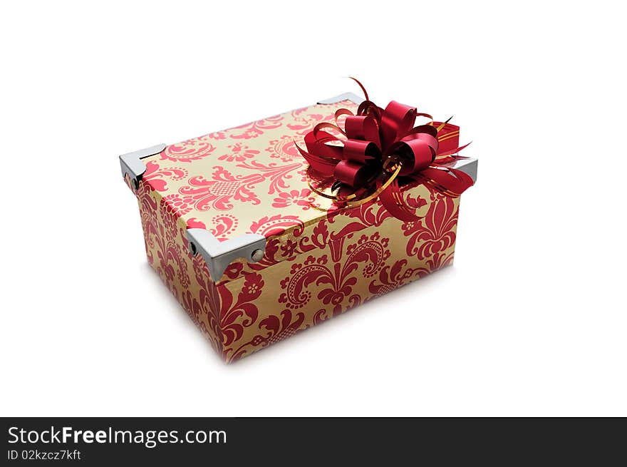 Isolated bright gift box with a red bow on it