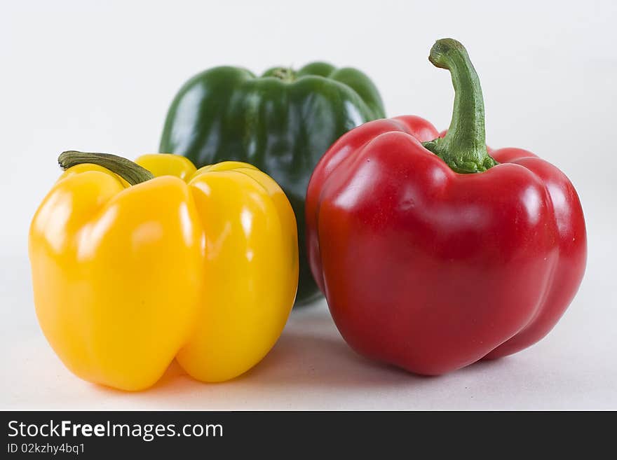 Fresh red, green and yellow bell peppers isolated. Fresh red, green and yellow bell peppers isolated