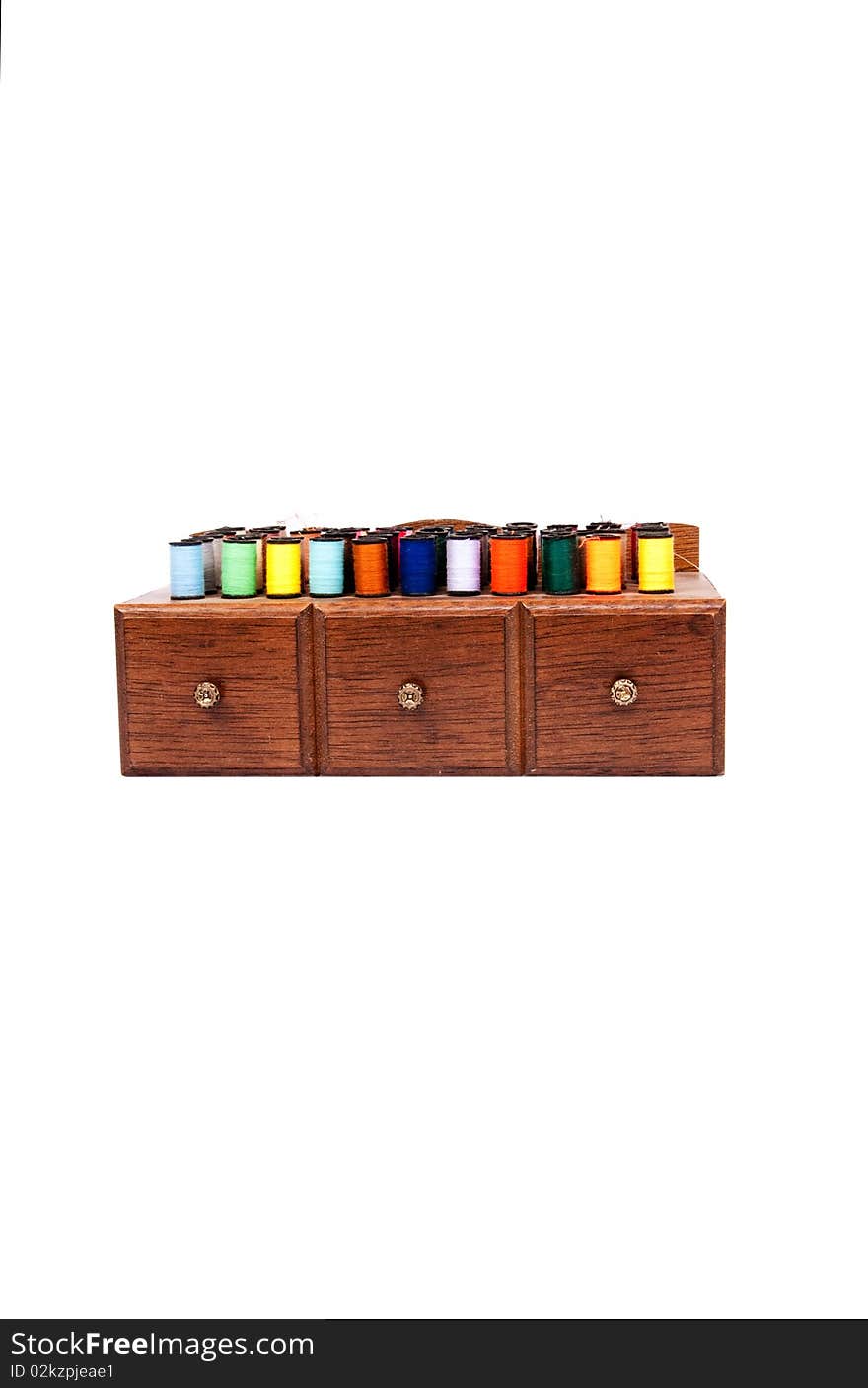 A small sewing cabinet with colorful thread