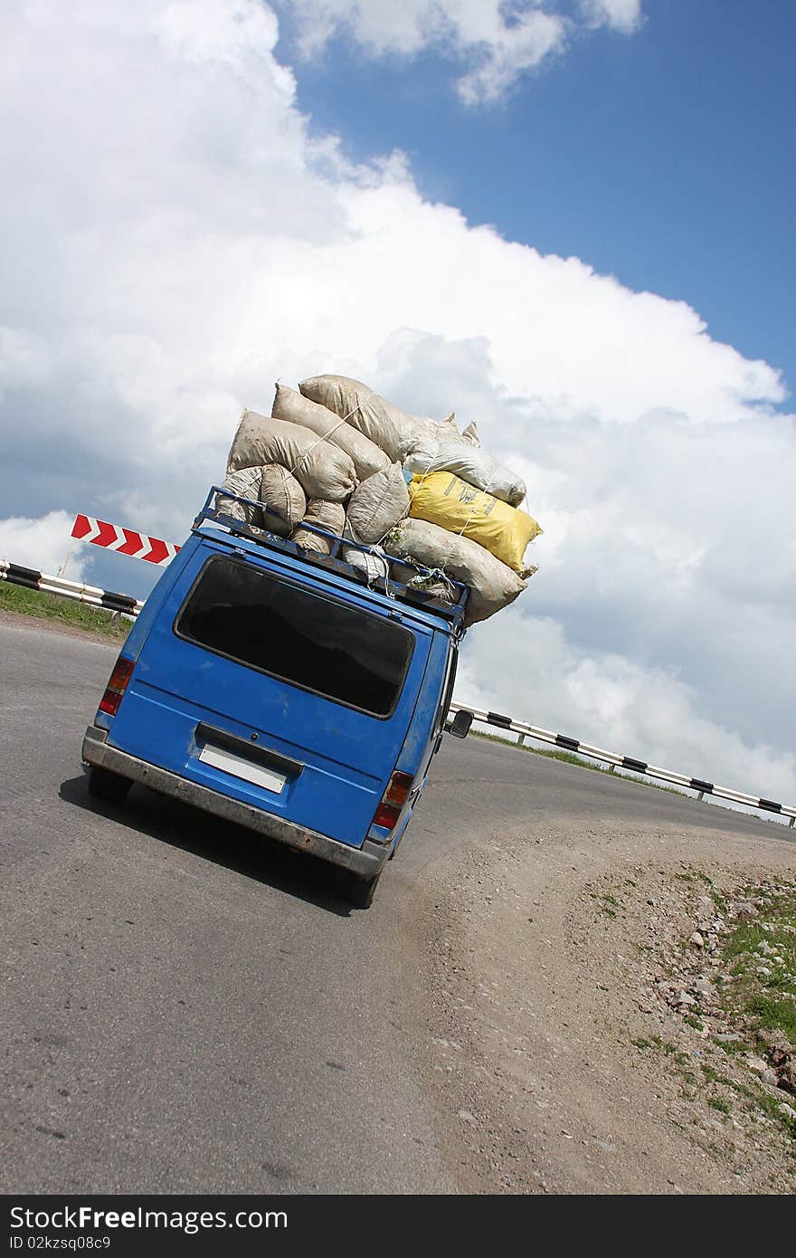 A  car with cargo sacks. A  car with cargo sacks