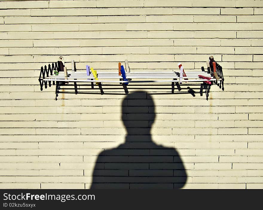 Hanger on a brick wall with shadow