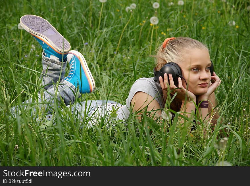 Girl listen music. outdoor shot