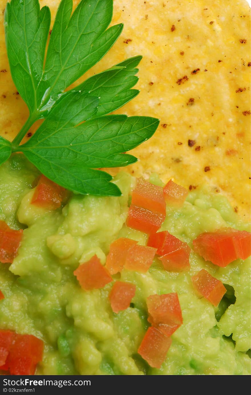 Close up of guacamole and corn chip