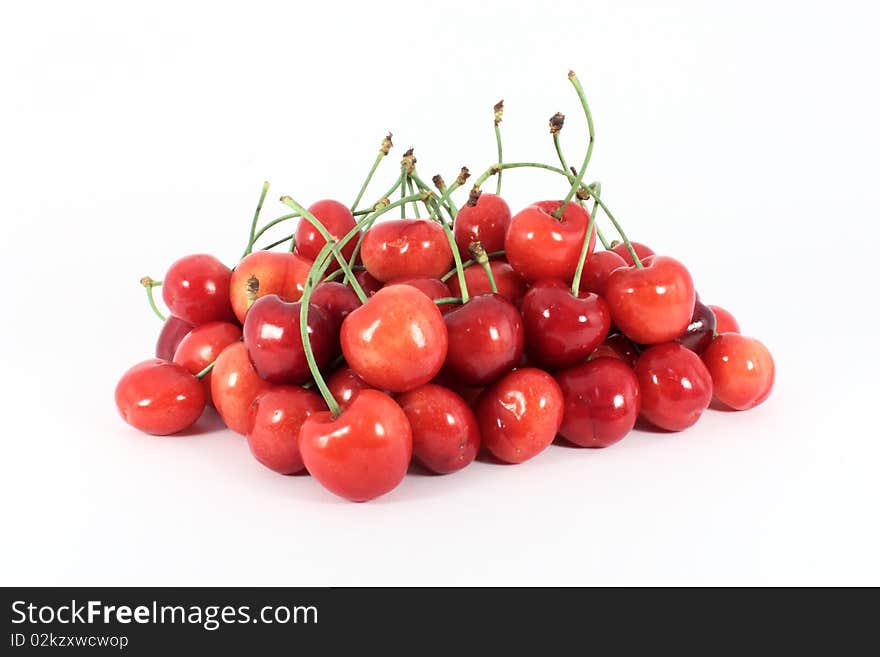 Heap of sweet cherries isolated on white