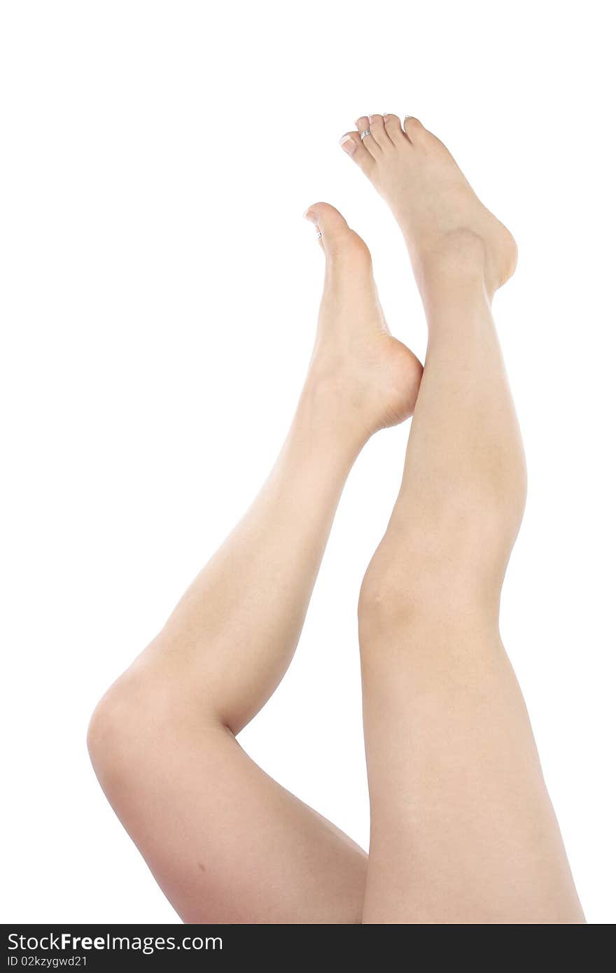 Woman legs and feet isolated over white