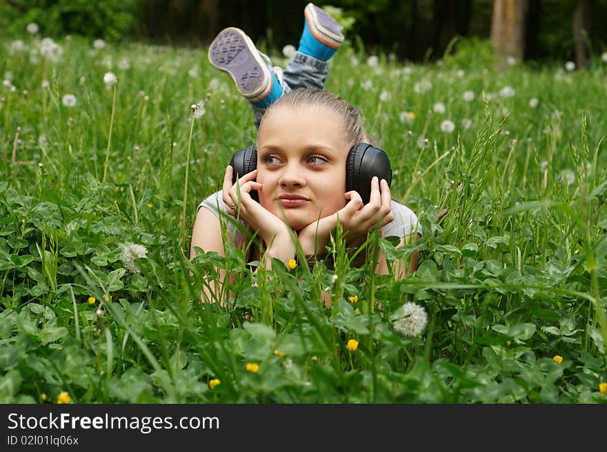 Girl on meadow in summer day