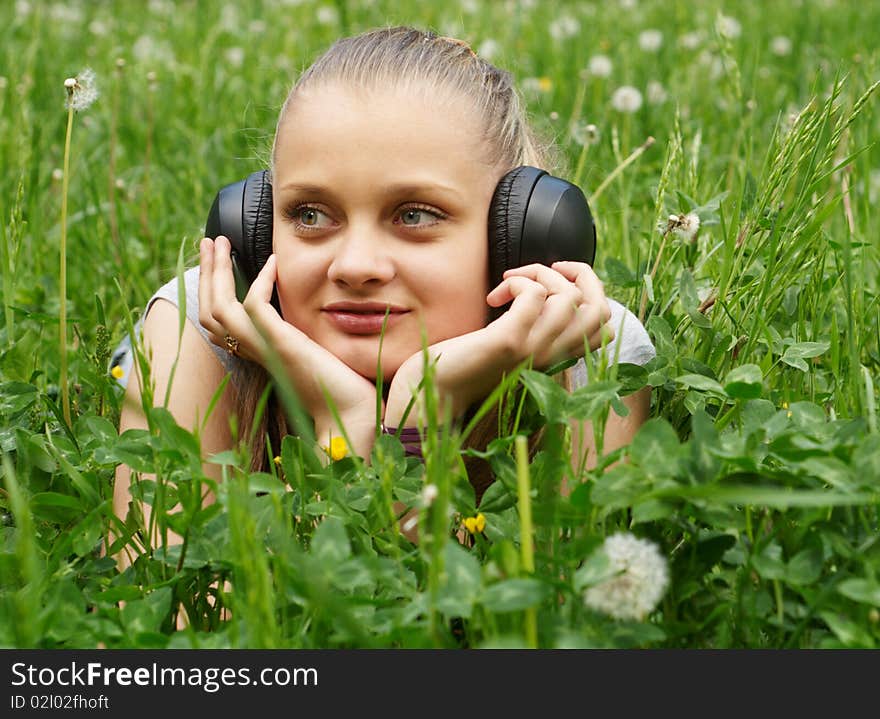 Girl on meadow with dandelion