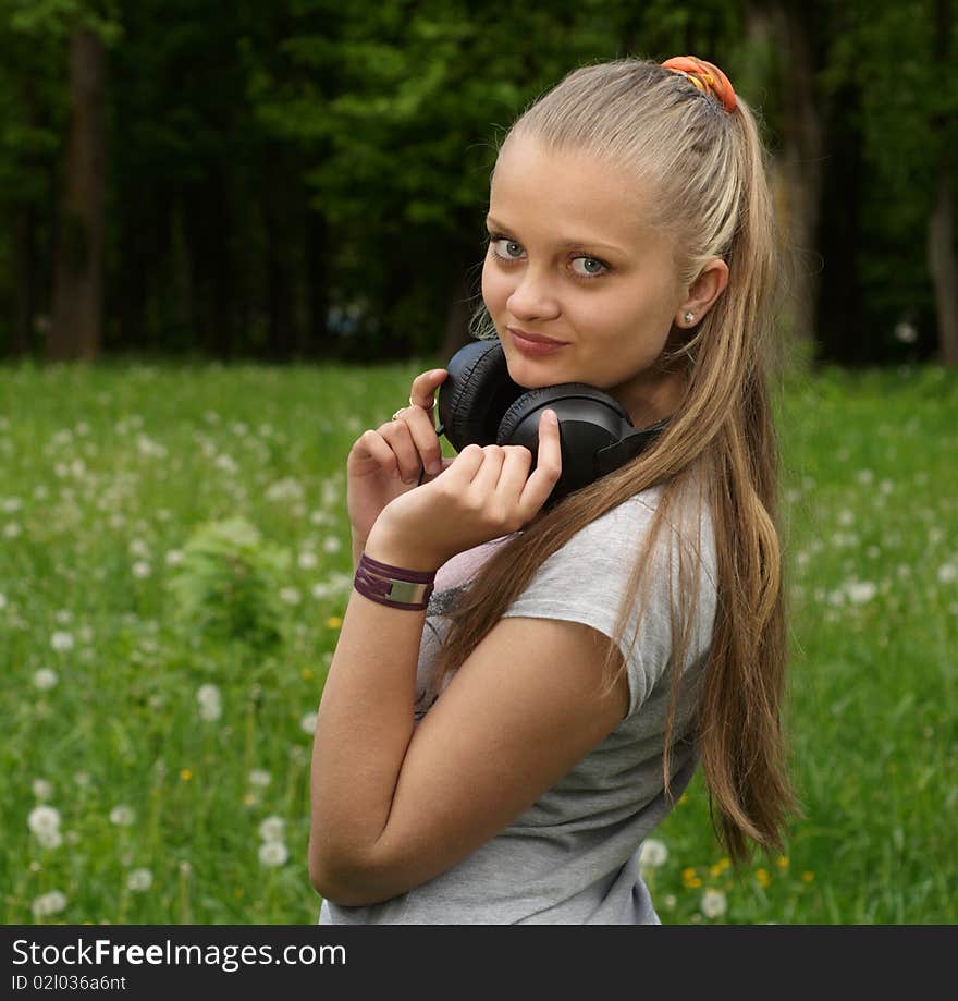 Girl on meadow in summer day