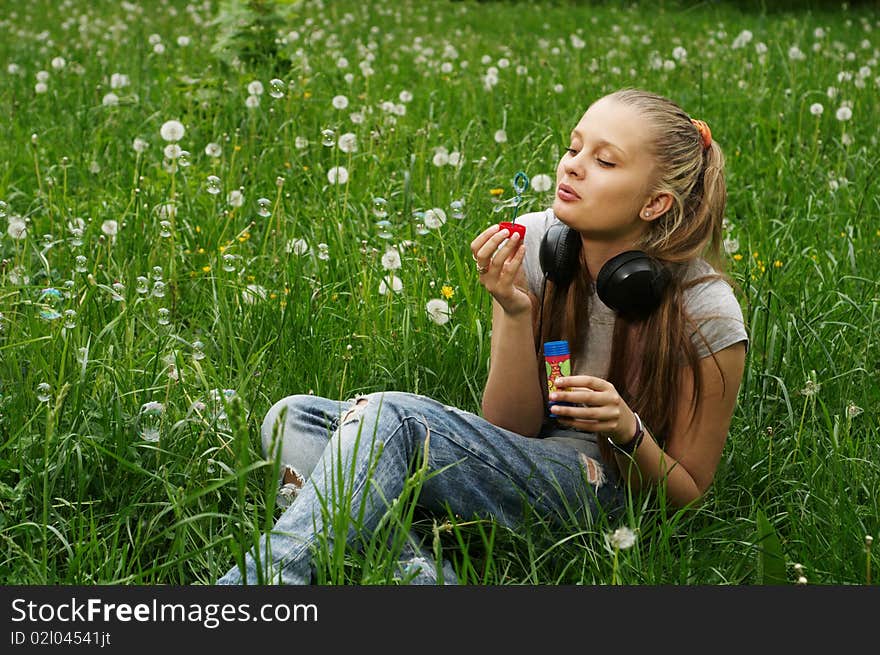 Girl on meadow with dandelion