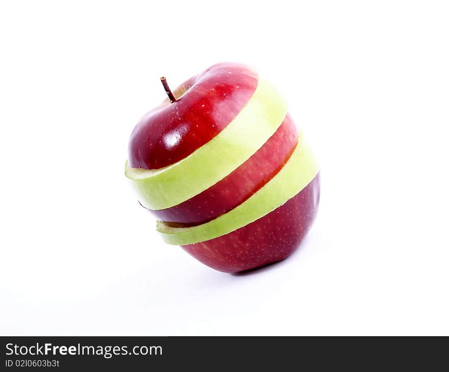 Green and red apple slices on white background. Concepts: Fruit, Food, Nutrition and Welfare