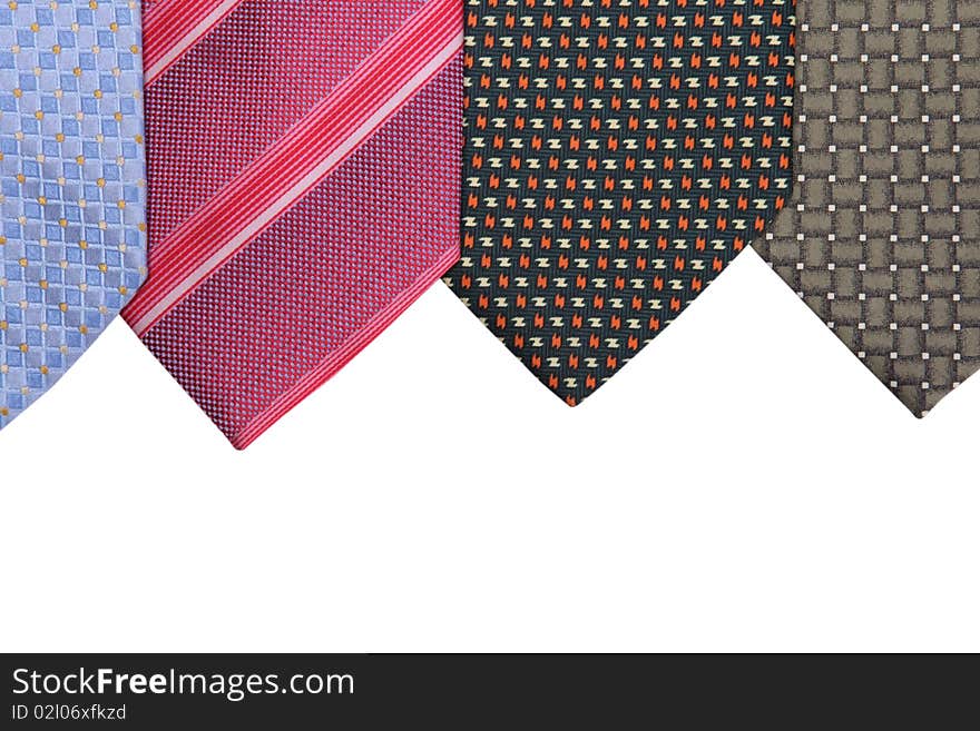 Blue, magenta, brown and black elegance ties on white background. Close up image