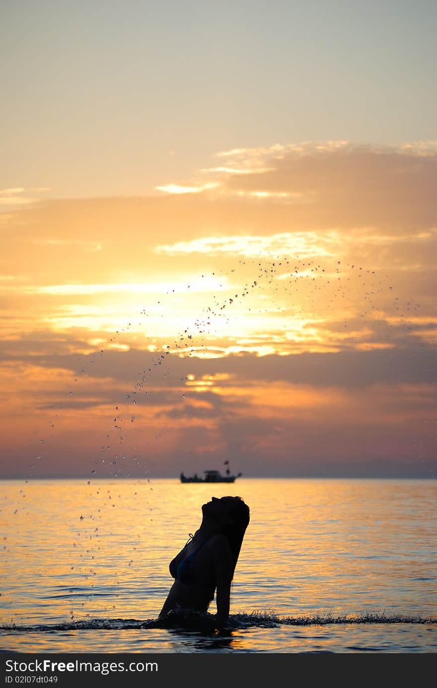 Young girl breaking out from sea