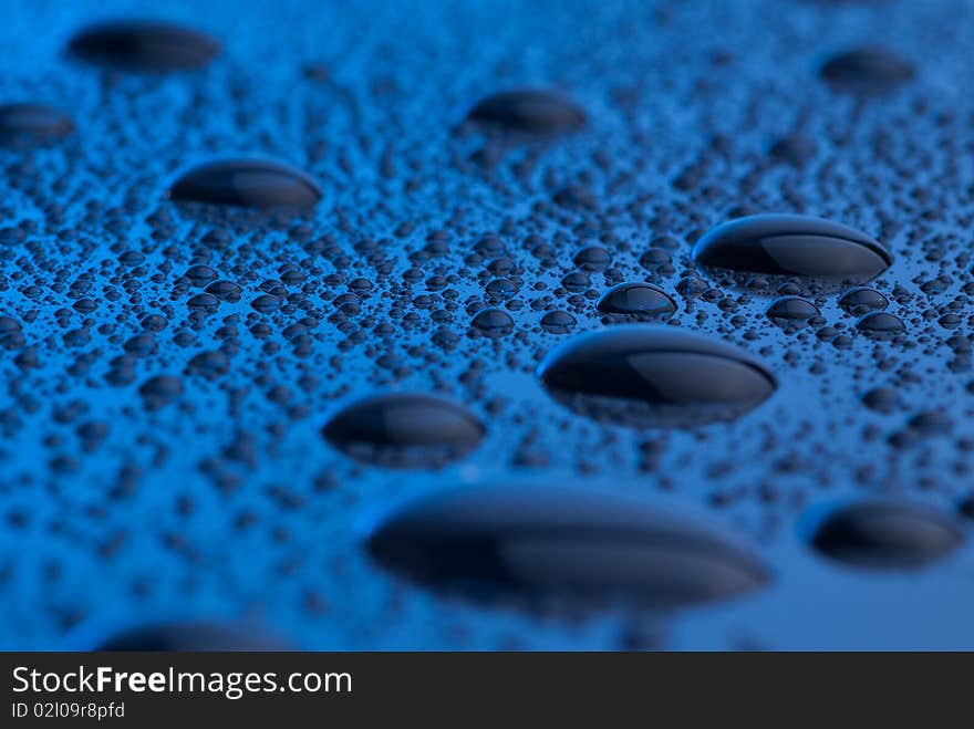 Macro photo of blue water drops. Macro photo of blue water drops