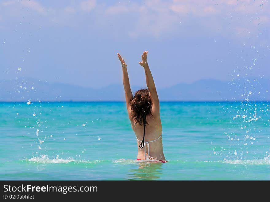 Girl with long hair playing in the sea. Girl with long hair playing in the sea