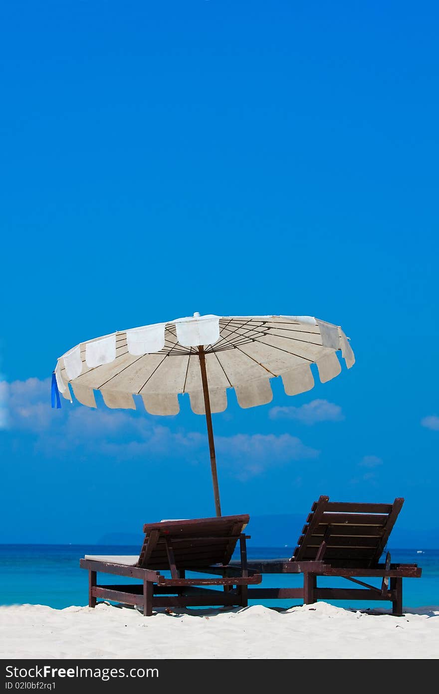 Two chear on the beach at the sea