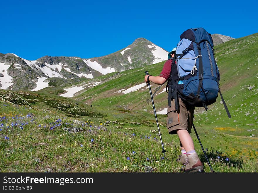 Hiker boy in Caucasus mountains