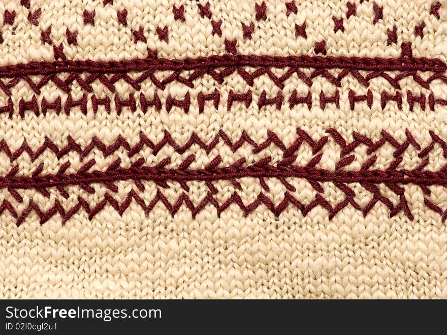 Knitted texture with the elements of decorative pattern. Knitted texture with the elements of decorative pattern