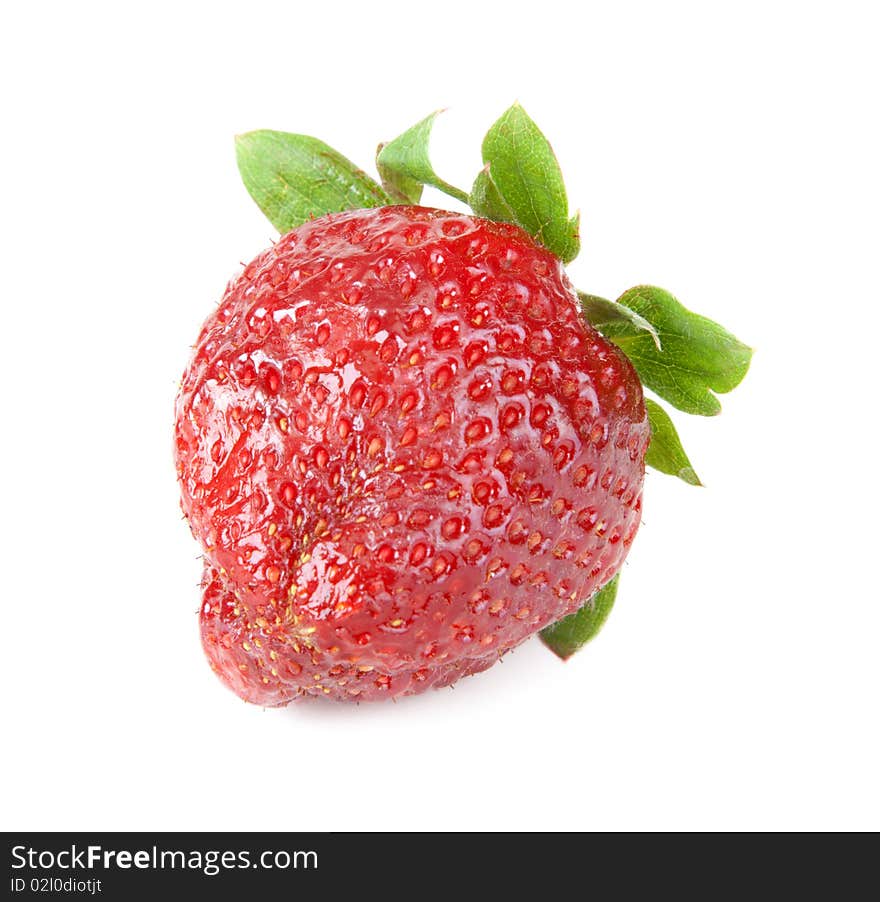 Ripe berry of the strawberries with green sheet on white background