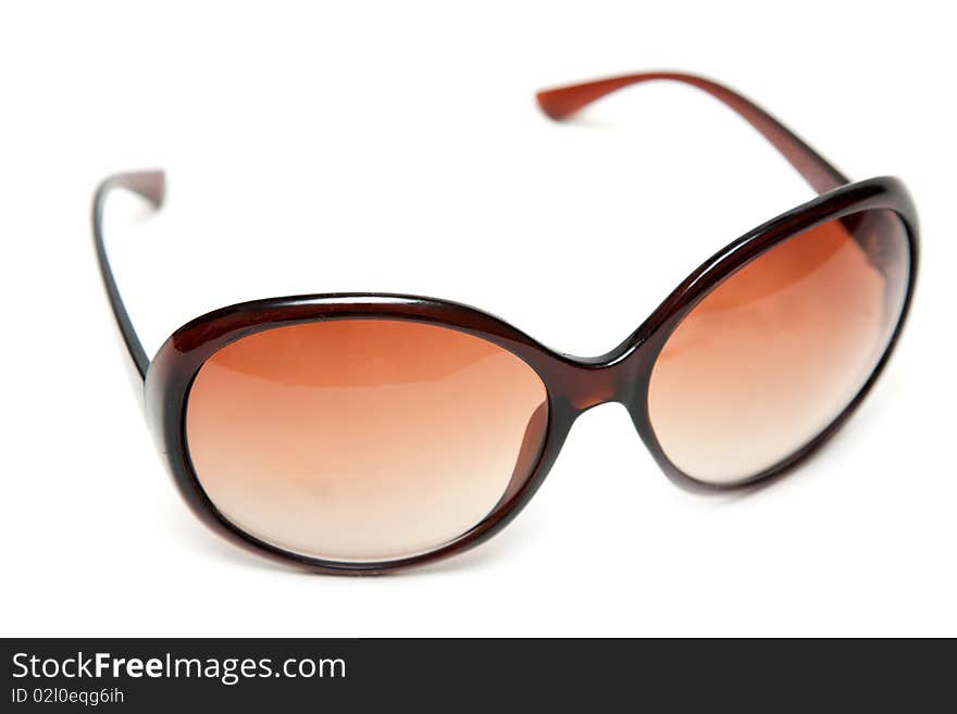 Brown sunglasses with translucent lens on white background