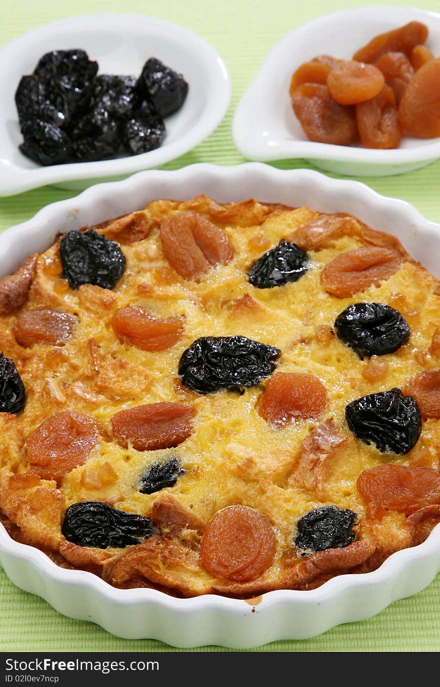 Clafoutis baked French dessert with plums and apricots