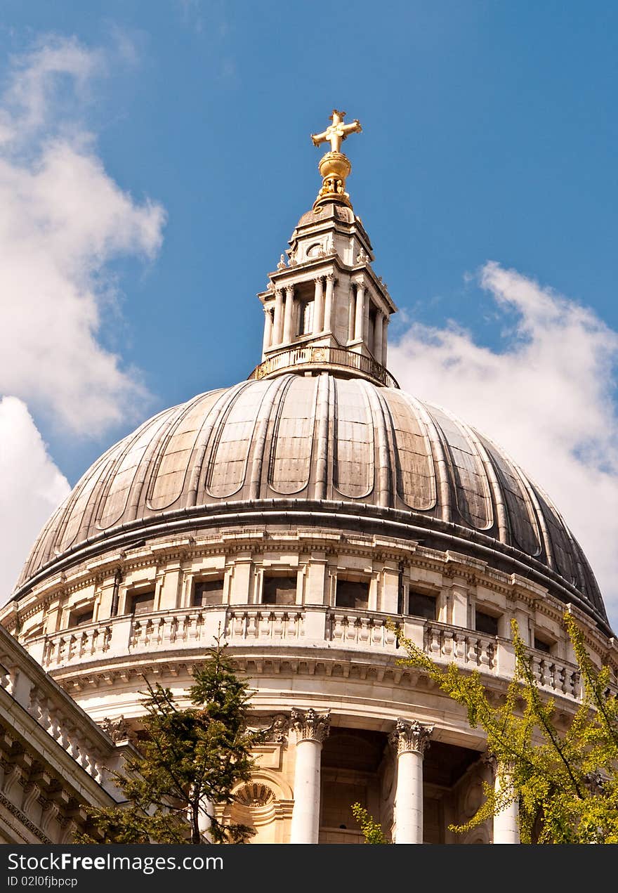 A view of the famous dome, topped by a golden cross, St Paul's Cathedral London. A view of the famous dome, topped by a golden cross, St Paul's Cathedral London.