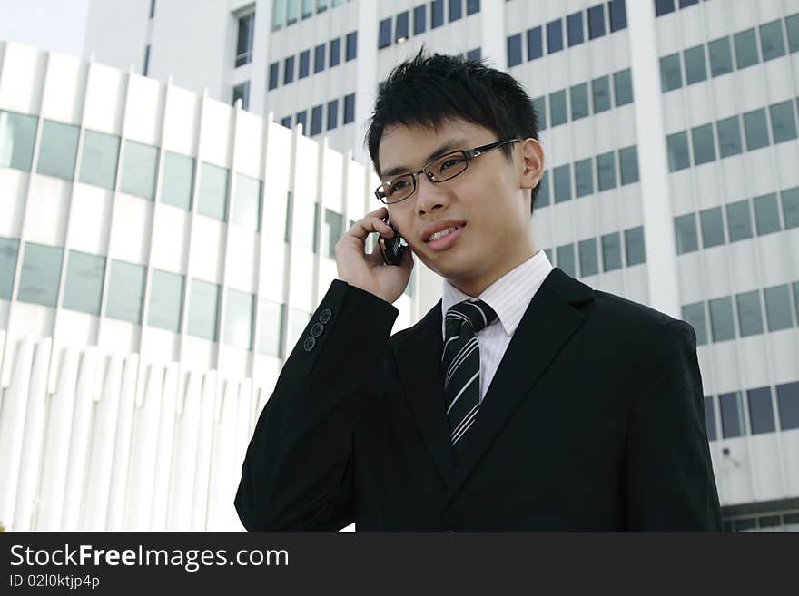 Asian businessman talking on the phone