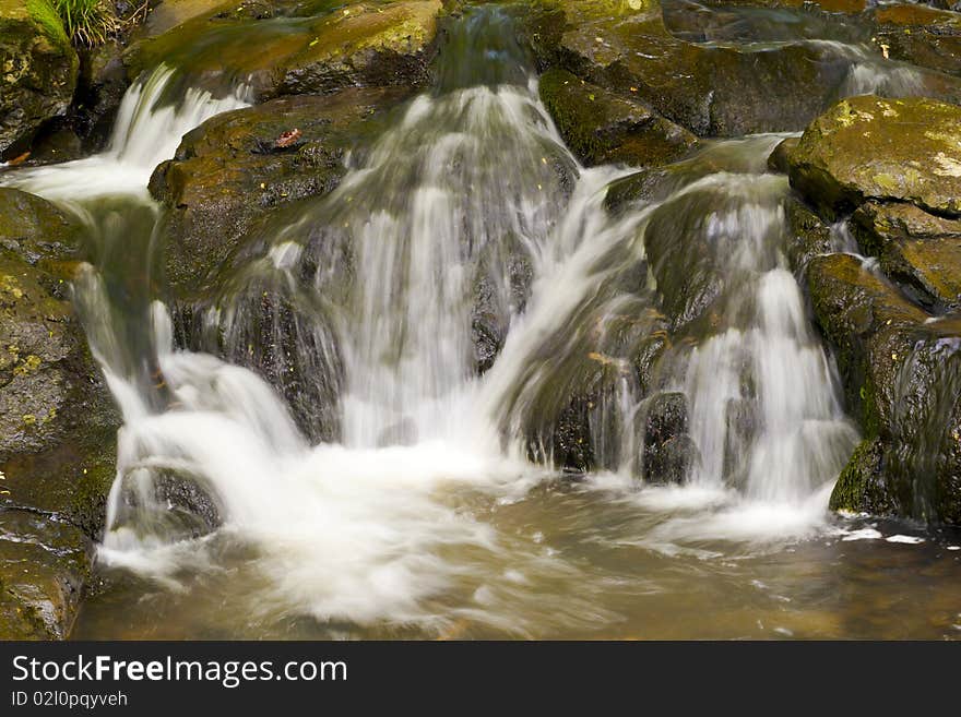 Rocky, stony river with a waterfall. Rocky, stony river with a waterfall.