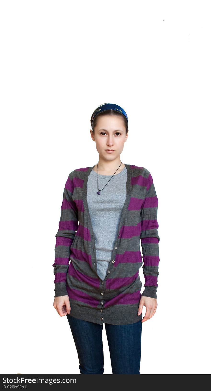 Young female in striped cardigan and jeans isolated. Young female in striped cardigan and jeans isolated