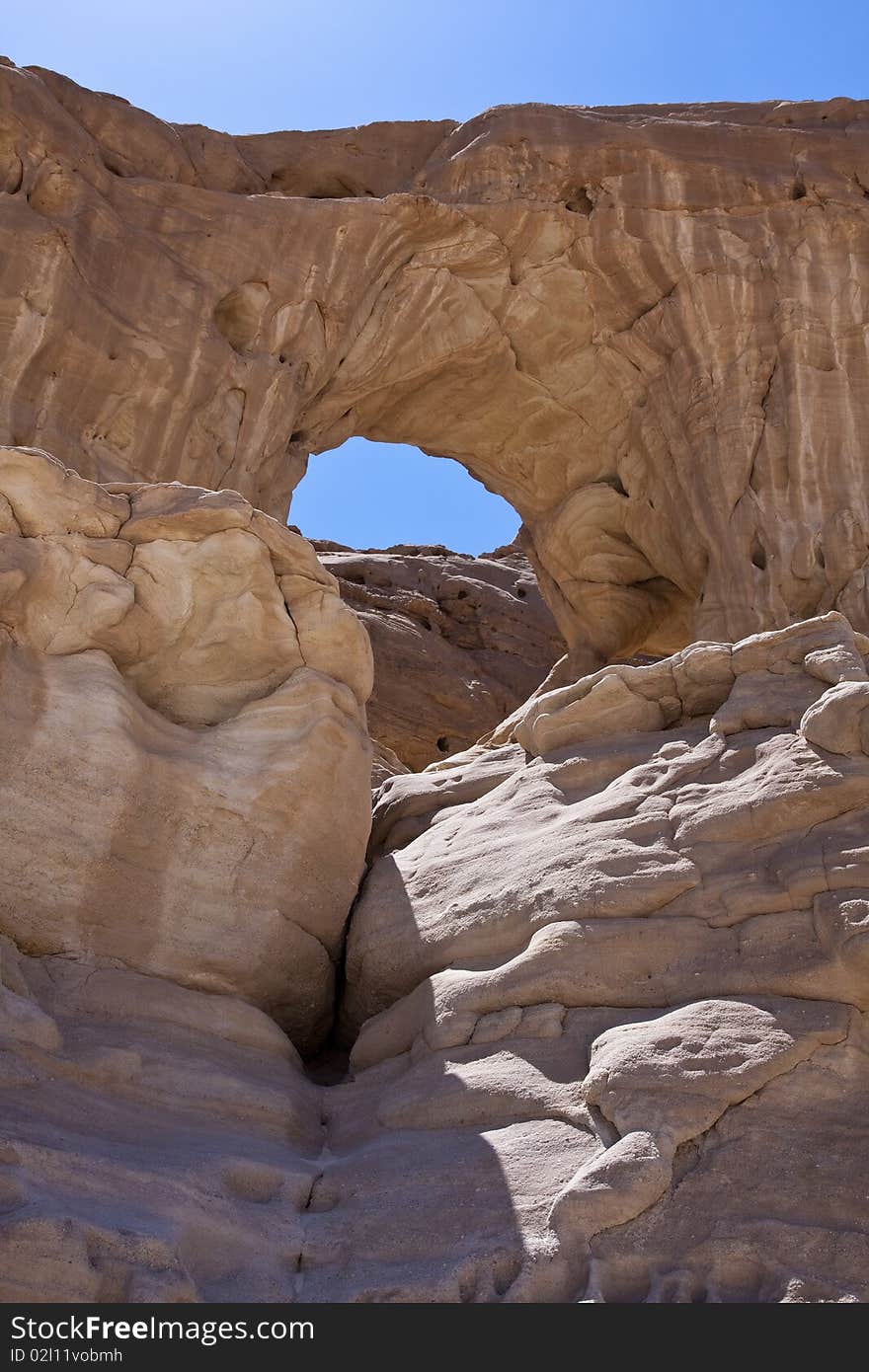 This arch located in Timna Park. The park is located approximately 25 kilometers north of Eilat, in the middle of the Red Sea Desert. This arch located in Timna Park. The park is located approximately 25 kilometers north of Eilat, in the middle of the Red Sea Desert.