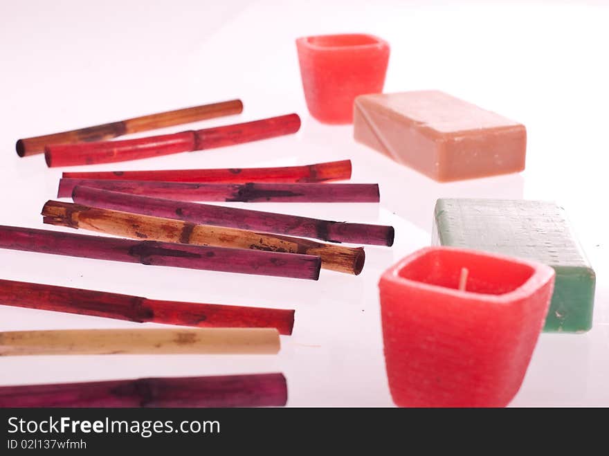 Spa concept with incense, soaps and candles isolated on white background