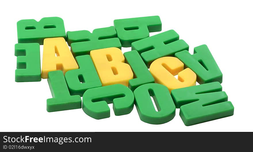 Among the green letters are seen the first three letters of the alphabet. Among the green letters are seen the first three letters of the alphabet